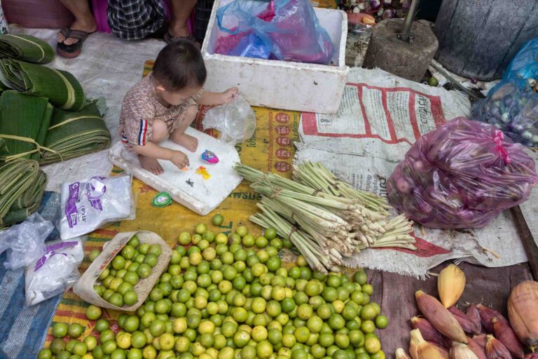 Kind der Limettenverkäuferin
